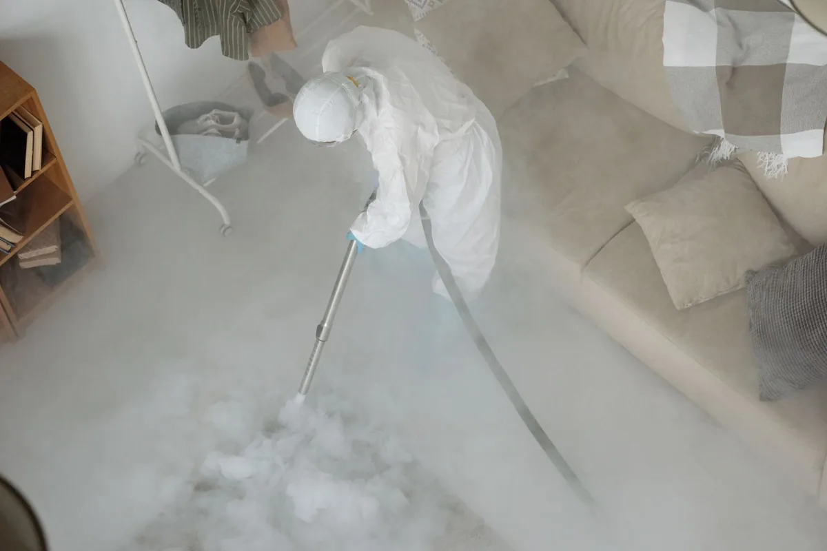 Biohazard cleanup technician in protective equipment, Crosby, TX